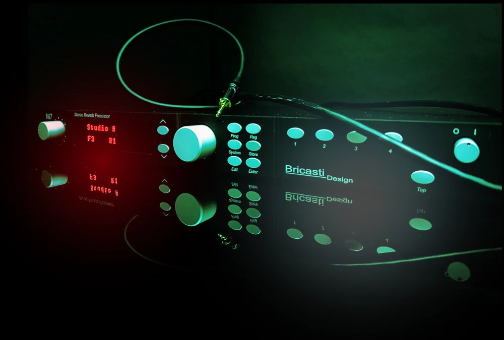 The Bricasti M7 stereo reverb processor in a darkened studio rack, its display and controls glowing.